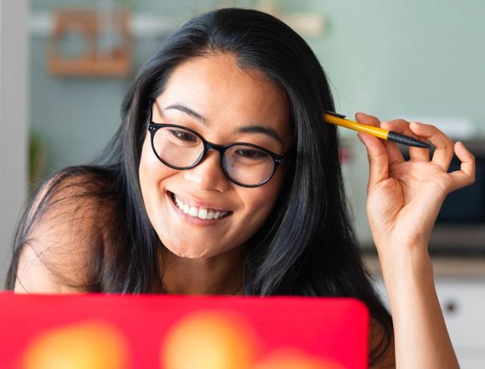 woman at laptop smiling